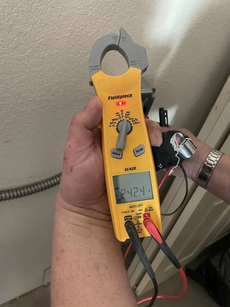 Voltage testing with clamp meter during Outlet Installation in Prairie du Chien